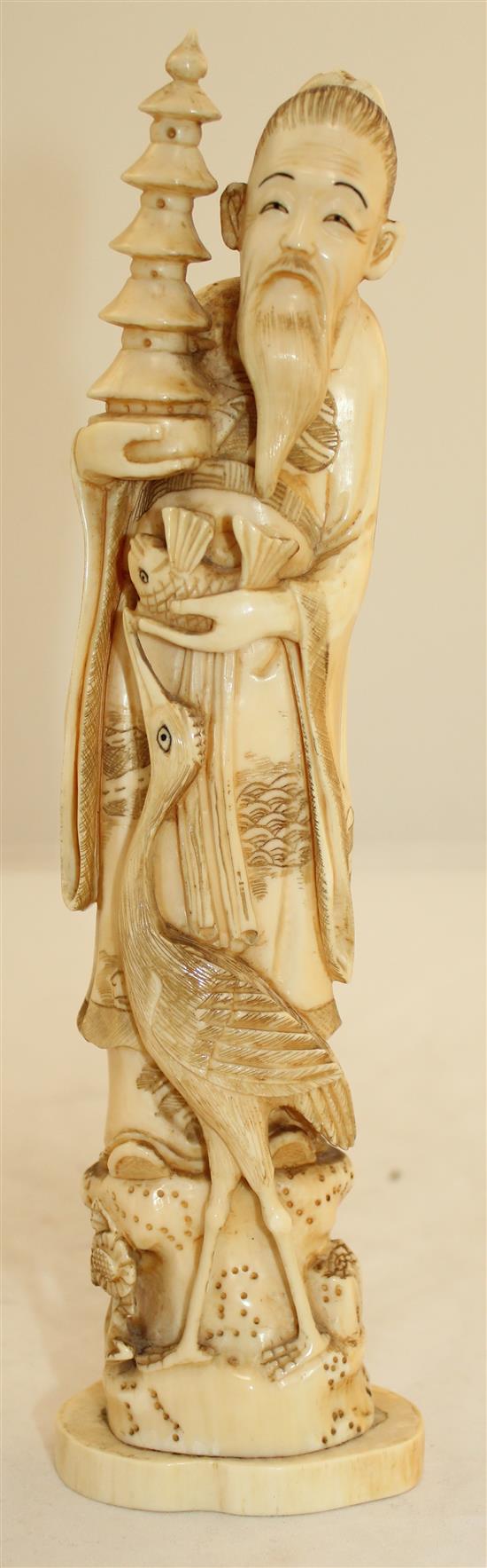 A Japanese walrus ivory figure of an immortal, early 20th century, 23.7cm